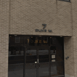 Exterior shot of brick building of new office
